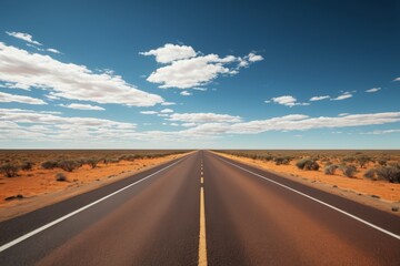 Naklejka premium there is a long road that is empty in the middle of the desert