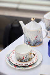 An Elegant Tea Set featuring a Floral Design including a beautifully crafted Teapot