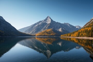 Obraz premium mountains are reflected in the water of a lake in the mountains