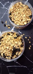 Healthy food and snack. Granola cereal in the jar. oat, almond and raisin. Diet snack. breakfast or dessert topping. natural grain.