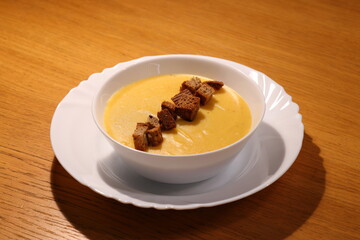 Enjoy a Deliciously Creamy Pumpkin Soup with Croutons Perfect for Any Autumn Day