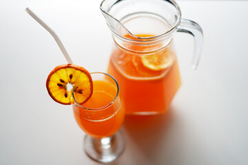 Freshly Squeezed Orange Juice in Jug and Glass. High Quality Stock Photo