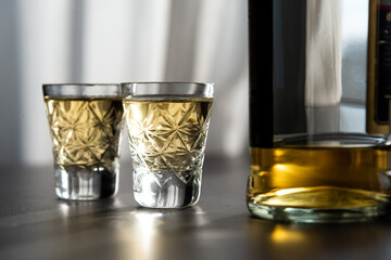 Two Shots Of Georgian ChaCha Brandy. Two shots of ChaCha in the harsh light. ChaCha in crystal glass.