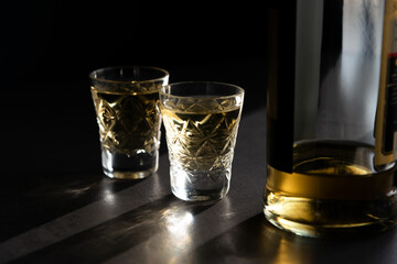 Two Shots Of Georgian ChaCha Brandy. Two shots of ChaCha in the harsh light. ChaCha in crystal glass.