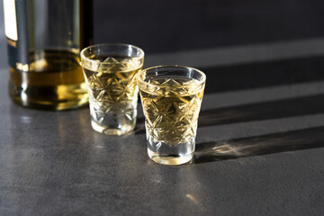 Two Shots Of Georgian ChaCha Brandy. Two shots of ChaCha in the harsh light. ChaCha in crystal glass. Top View