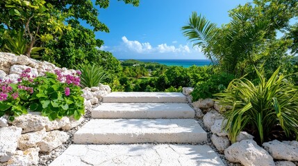Obraz premium Stone steps leading to scenic ocean view, lush tropical garden.