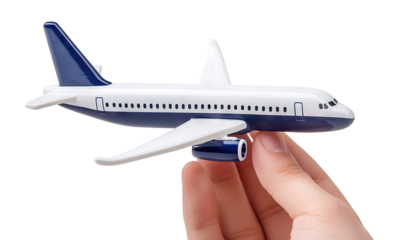 Miniature model airplane in hand, isolated on transparent cutout background