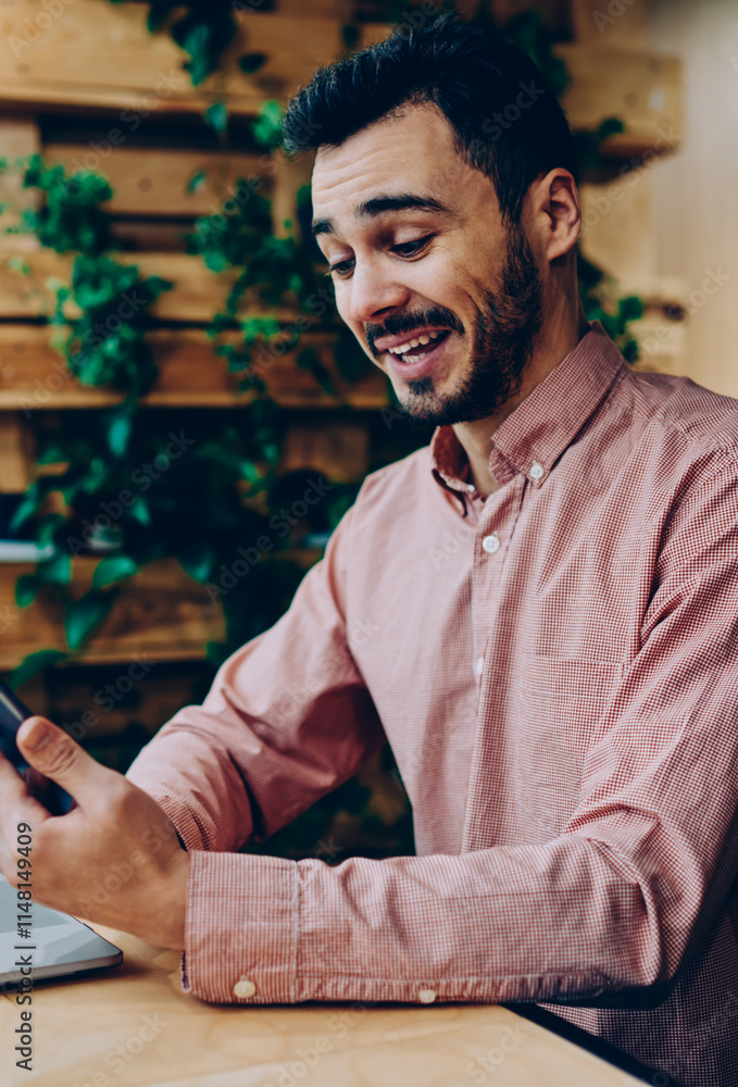 Poster wondered bearded guy amazed with text message reading mail on smartphone, emotional hipster guy laug