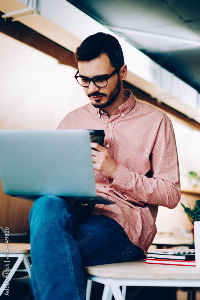 Aufkleber serious male employees concentrated on productive job using technology in office,guy checking notifi