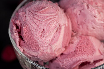delicious sweet cold raspberry-flavored ice cream and ripe raspberries in a glass
