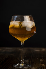 transparent glass with cold apple juice with ice