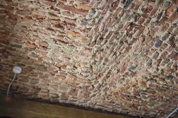 An enchanting Textured Brick Ceiling featuring a Rustic Charm that attracts attention