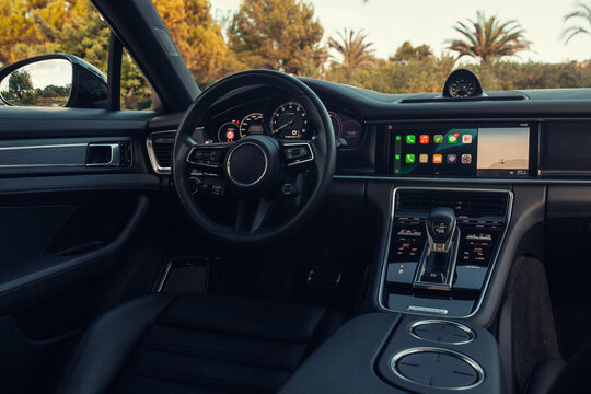 Modern expensive convertible car interior with leather panel, sport seats, multimedia and digital dashboard