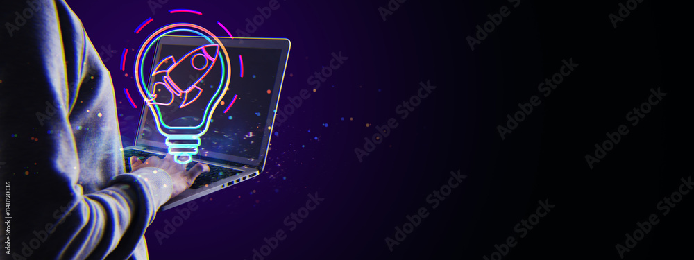 Aufkleber neon glowing lightbulb with rocket inside displayed over laptop in dark background.