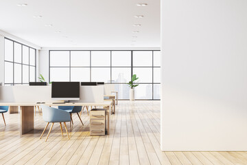 Modern open office interior with desks, chairs, large windows, and wooden flooring. 3D Rendering