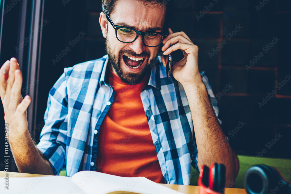 Aufkleber furious bearded hipster guy shouting during phone conversation on digital smartphone.angry young man