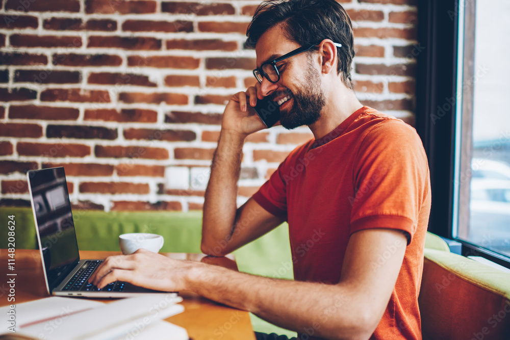 Aufkleber side view of positive bearded young man talking on smartphone device while typing text information o
