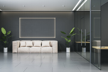 Modern office lobby interior with minimalist design, featuring a light sofa, glass walls, and green plants on a sleek black wall. 3D Rendering