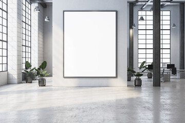 Blank vertical frame on white wall in modern office interior with large windows, plants, and desks in the background. 3D Rendering
