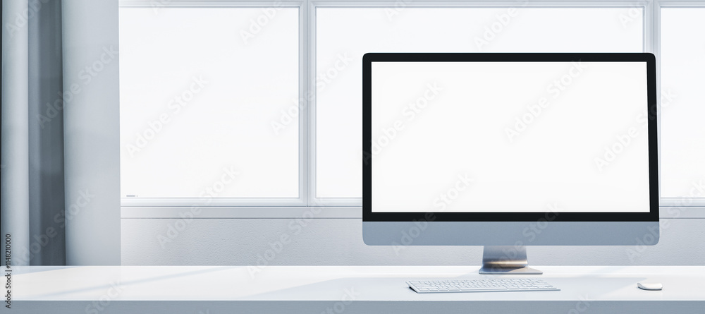 Poster minimalist desktop setup with blank computer monitor on white desk near large windows in a bright mo