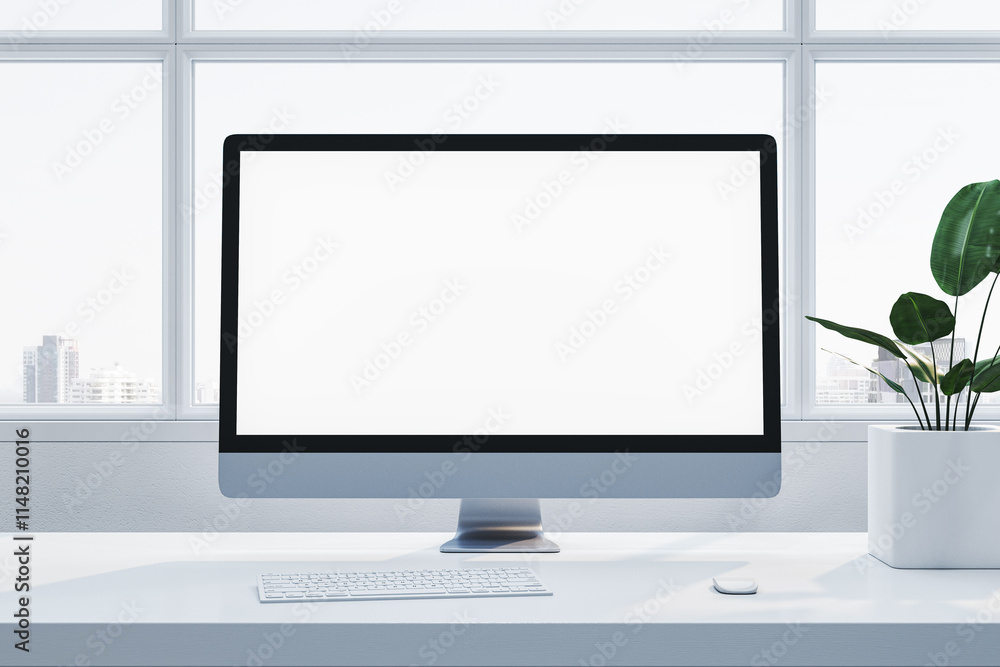Poster minimalist workstation featuring a blank desktop screen, keyboard, mouse, and plant on a white desk 