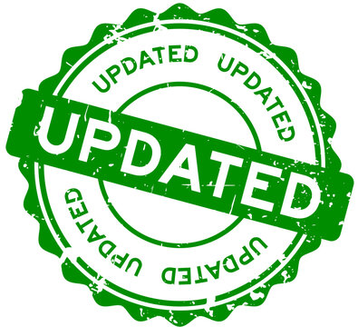 Grunge green updated word round rubber seal stamp on white background