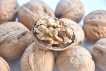 baked crispy walnut peel out arranging isolated on white background 