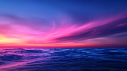 Obraz premium Vibrant sunset over calm ocean waves.