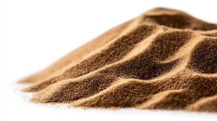 Close-up of a pile of brown sand against a white background, highlighting its texture and granular composition.