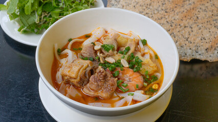 Vietnamese noodle Mi Quang. Mi Quang, Vietnamese rice noodles with meat, chicken stock, shrimp, egg, Vietnamese food.