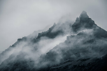 Rocky mountain covered in mist