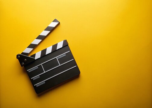 Night Filmmaking Clapperboard Top View - Cinematic Yellow Background