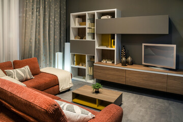 Modern living room furniture with comfortable red sofa and tv