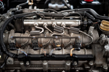 Close up of fuel injectors in a car motor engine