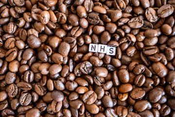 NHS written on coffee beans