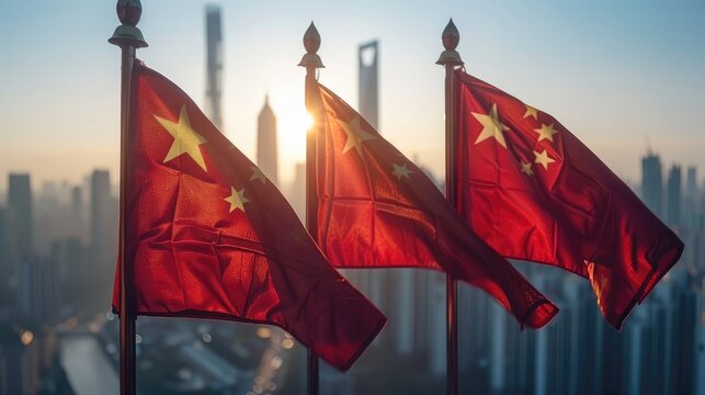 Chinese flags waving amid skyline signaling economic challenges during sunset