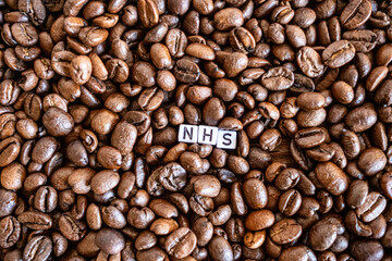 NHS sign on coffee beans