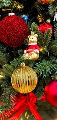 Christmas tree decorations - close up photo, decorative toys hanging on the fir tree