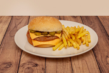  Burger is presented in a light bread bun split in two and has an oval or rounded shape