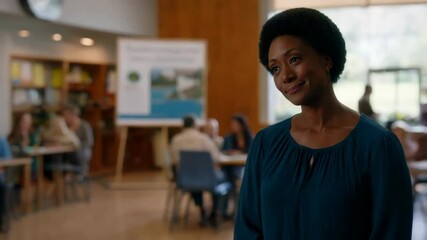 An engaged Black woman addresses attendees at a community event focused on environmental conservation and collaboration