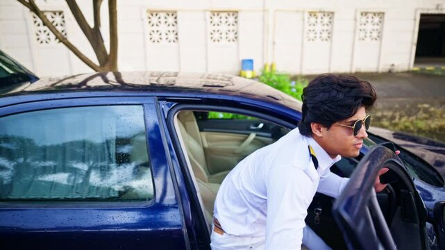 Pilot exits the car and begins walking
