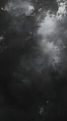 Fototapeta premium A dark, moody sky with clouds and hints of light breaking through.