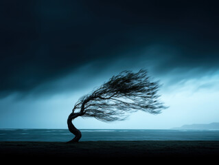 tree bending in wind, symbolizing resilience and strength