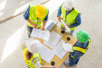 engineering teamwork meeting on table before inspection structure of construction site,civil...
