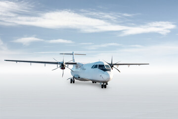 White passenger turboprop plane isolated on bright background with sky