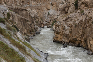 Exploring the winding banks of the Fan Darya river in the rugged landscape of Tajikistan
