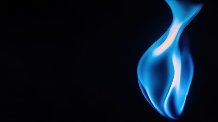 Obraz premium Vibrant blue flame dances against black background. Closeup view highlights soft curves, flickering light. Fluid movement, high color create dynamic visual. Artistic fire with strong contrast.