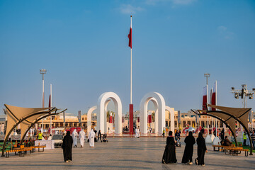 Doha, Qatar - December 13, 2024: Qatar National Day celebrations Qatari flag on the podium from...