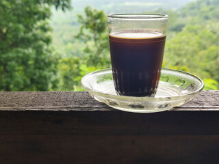 A cup of coffee while enjoying the beautiful mountain view.