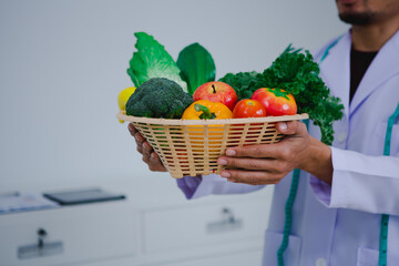 Asian male nutritionist specializing in promoting healthy eating habits, providing nutritional...